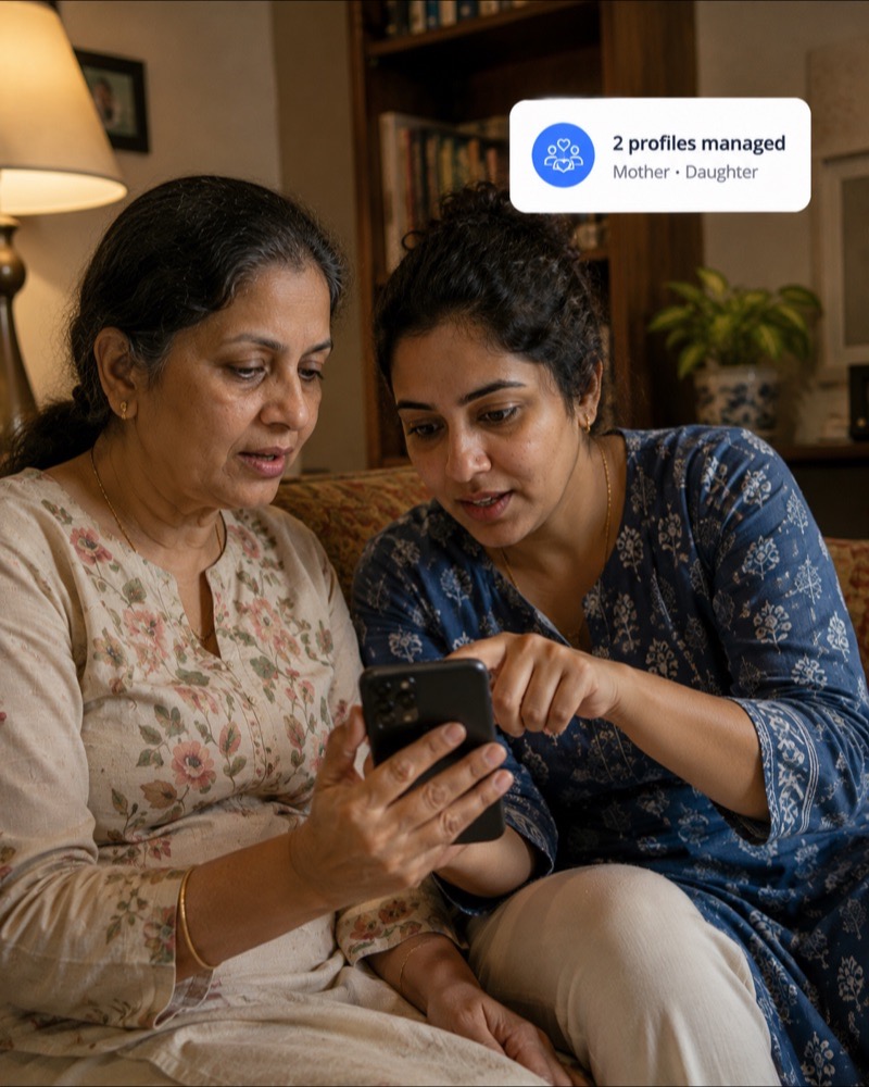 A mother and daughter sitting together on a sofa, looking at health records on one phone